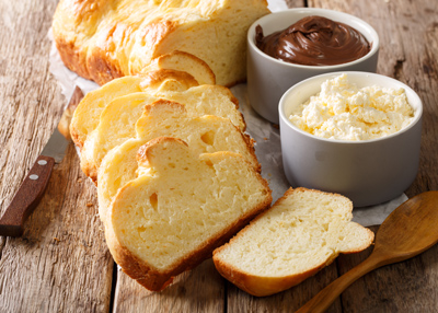 freshly baked bread slices with chocolate spread and creamy cheese on a wooden table delicious bread toppings